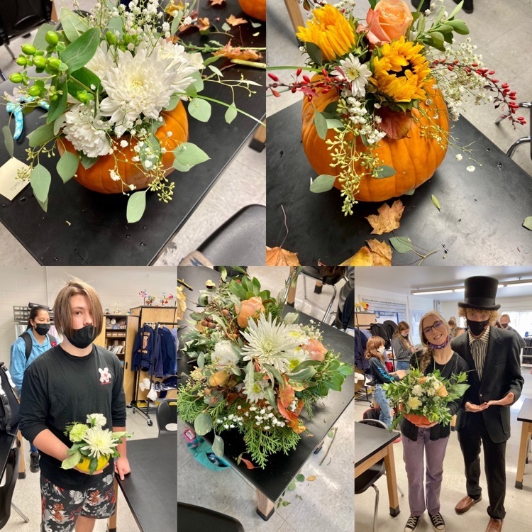 floral design class putting flowers in pumpkins